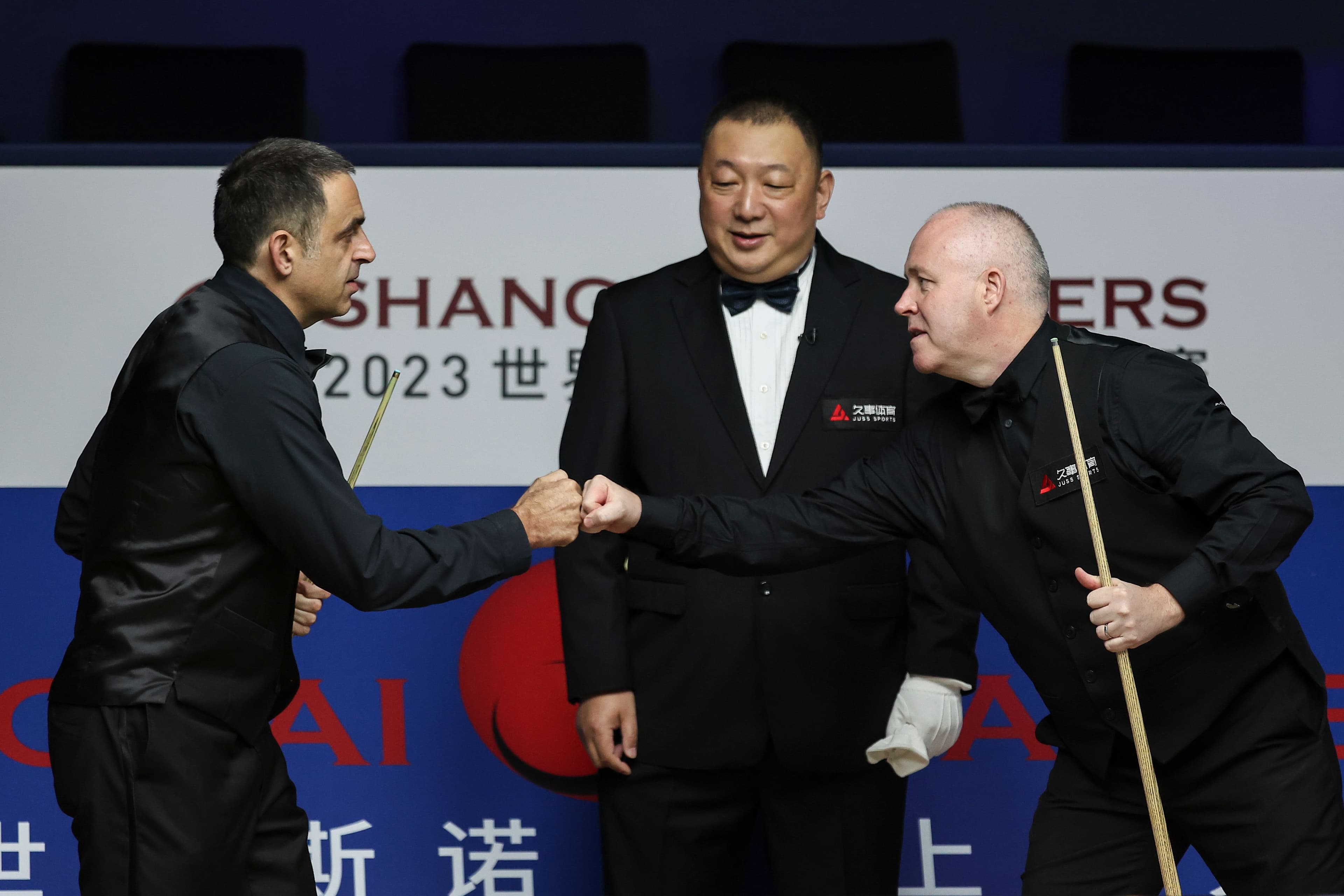 Ronnie O'Sullivan and John Higgins of Scotland in action
