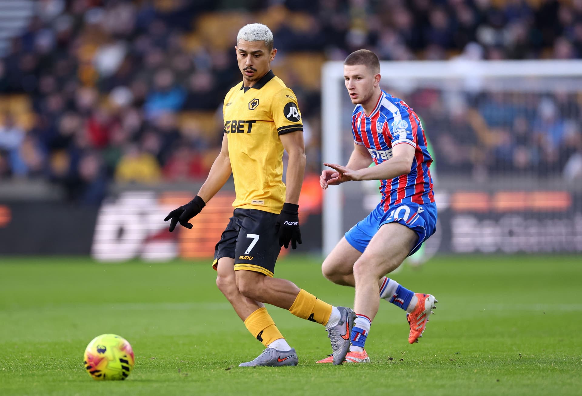 Andre of Wolverhampton Wanderers under pressure from Adam Wharton