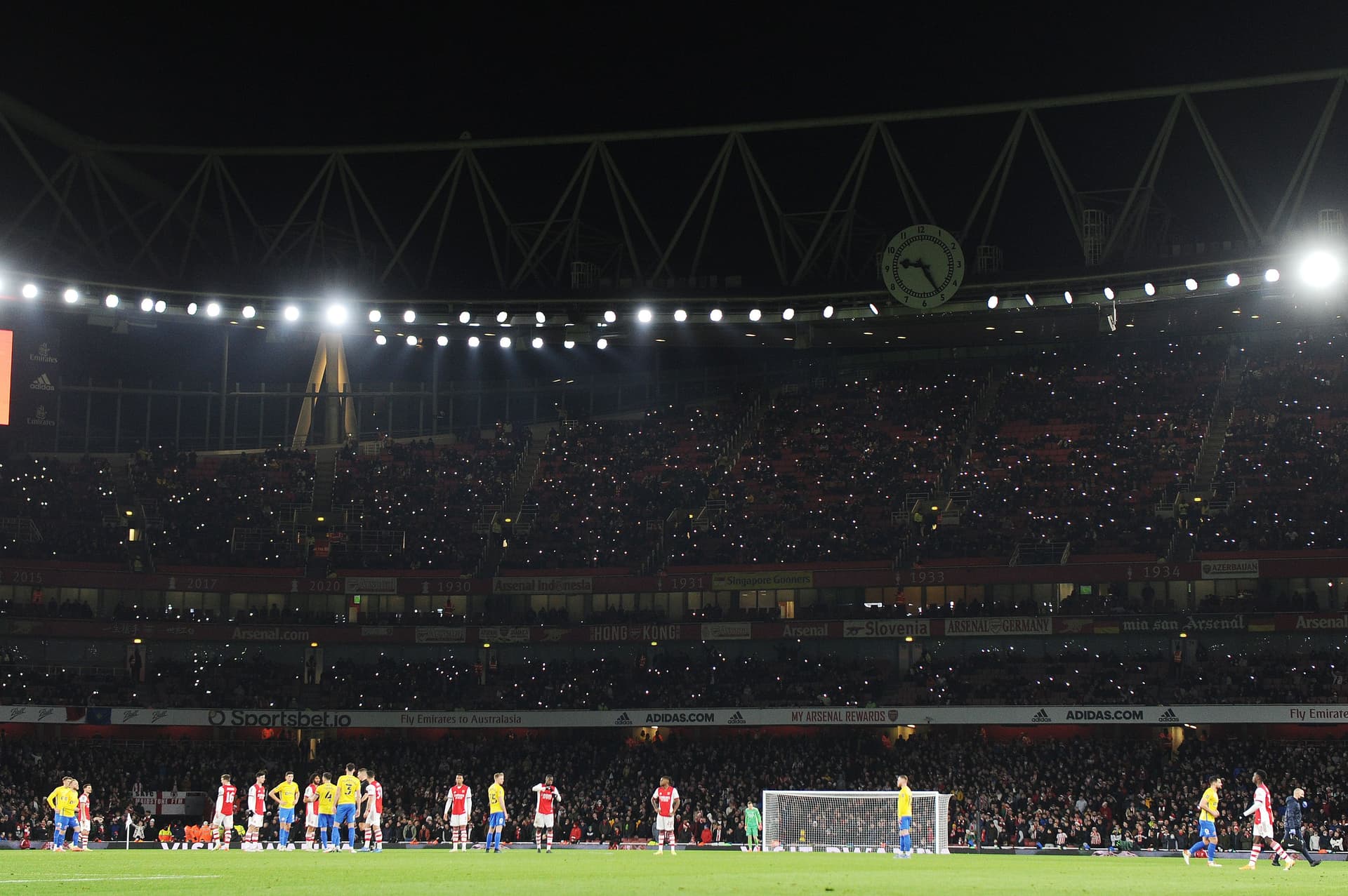 Arsenal fans light up the stadium during the Carabao Cup Quarter Final match