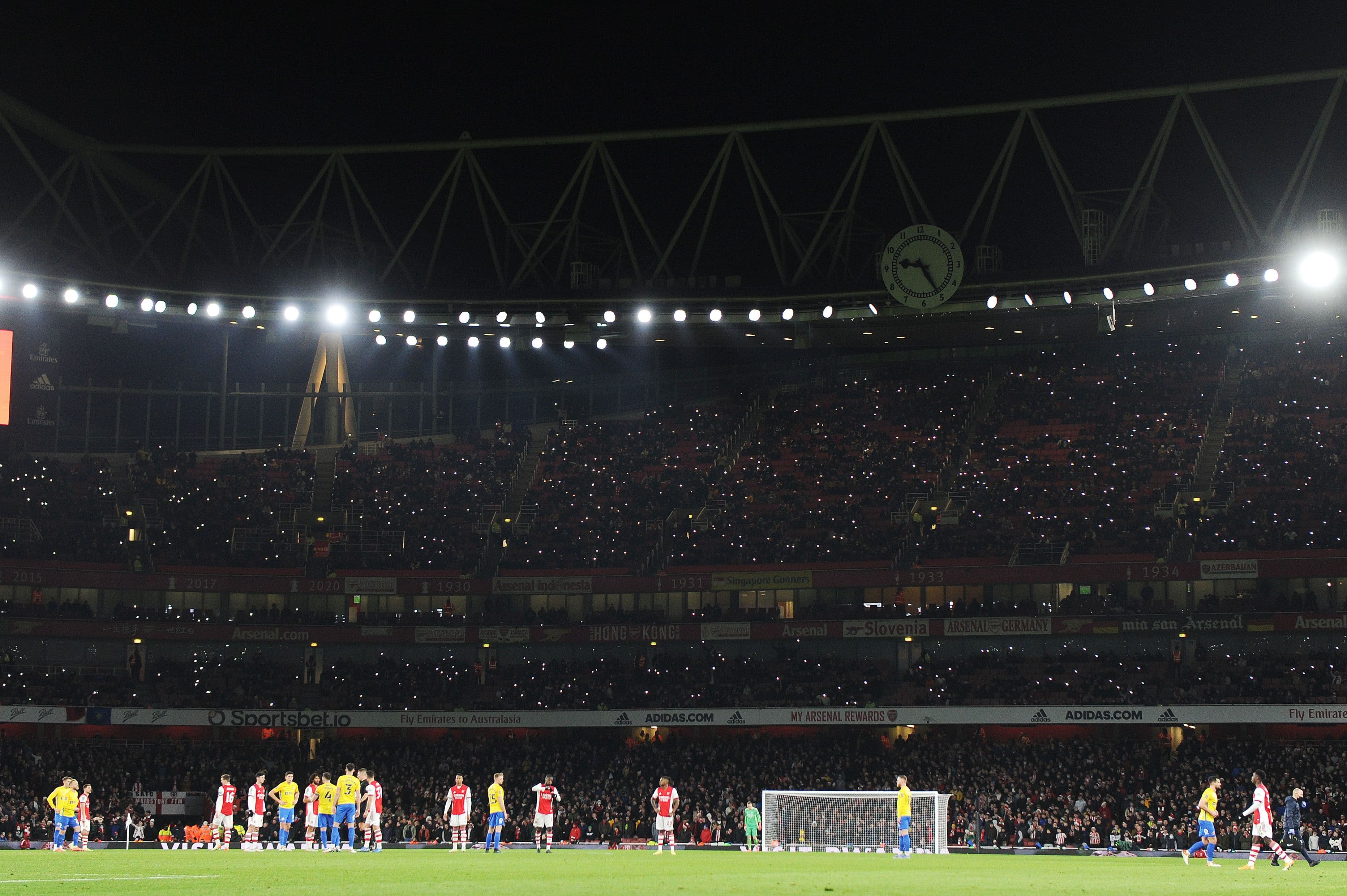 Arsenal fans light up the stadium during the Carabao Cup Quarter Final match