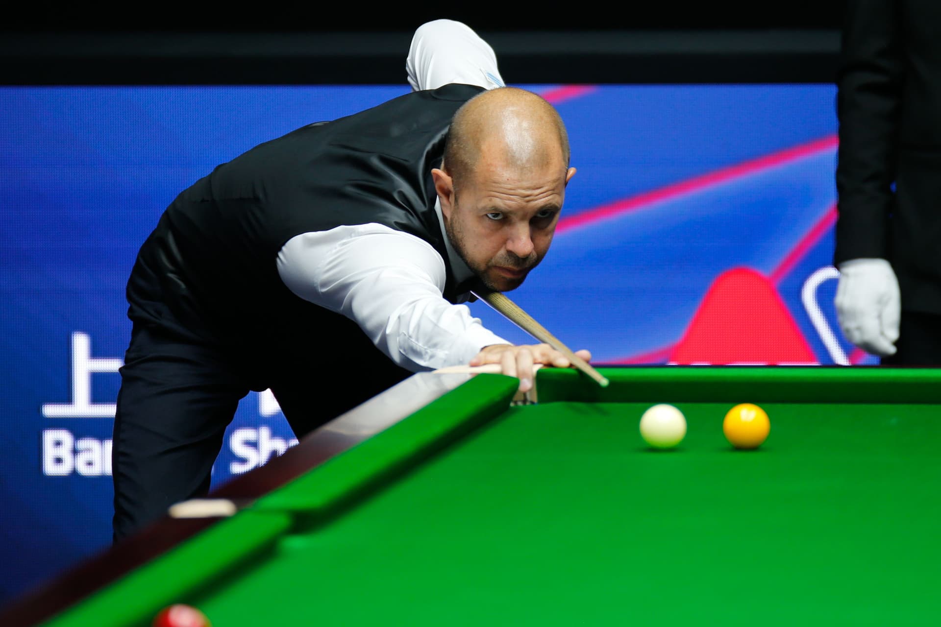 Barry Hawkins of England plays a shot