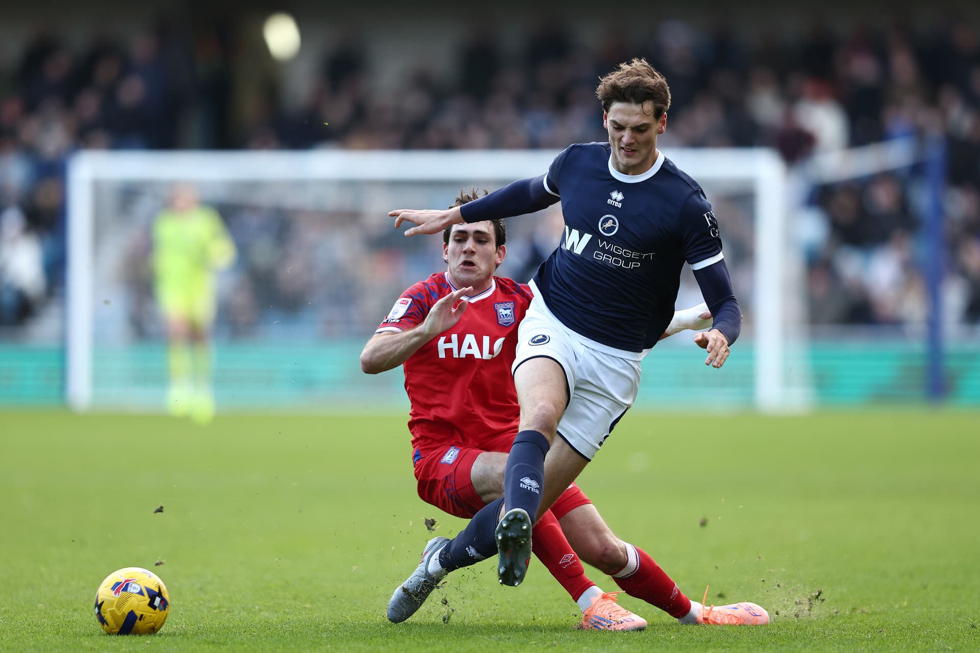 Caleb Taylor of Millwall is challenged by Ivan Azon of Ipswich Town