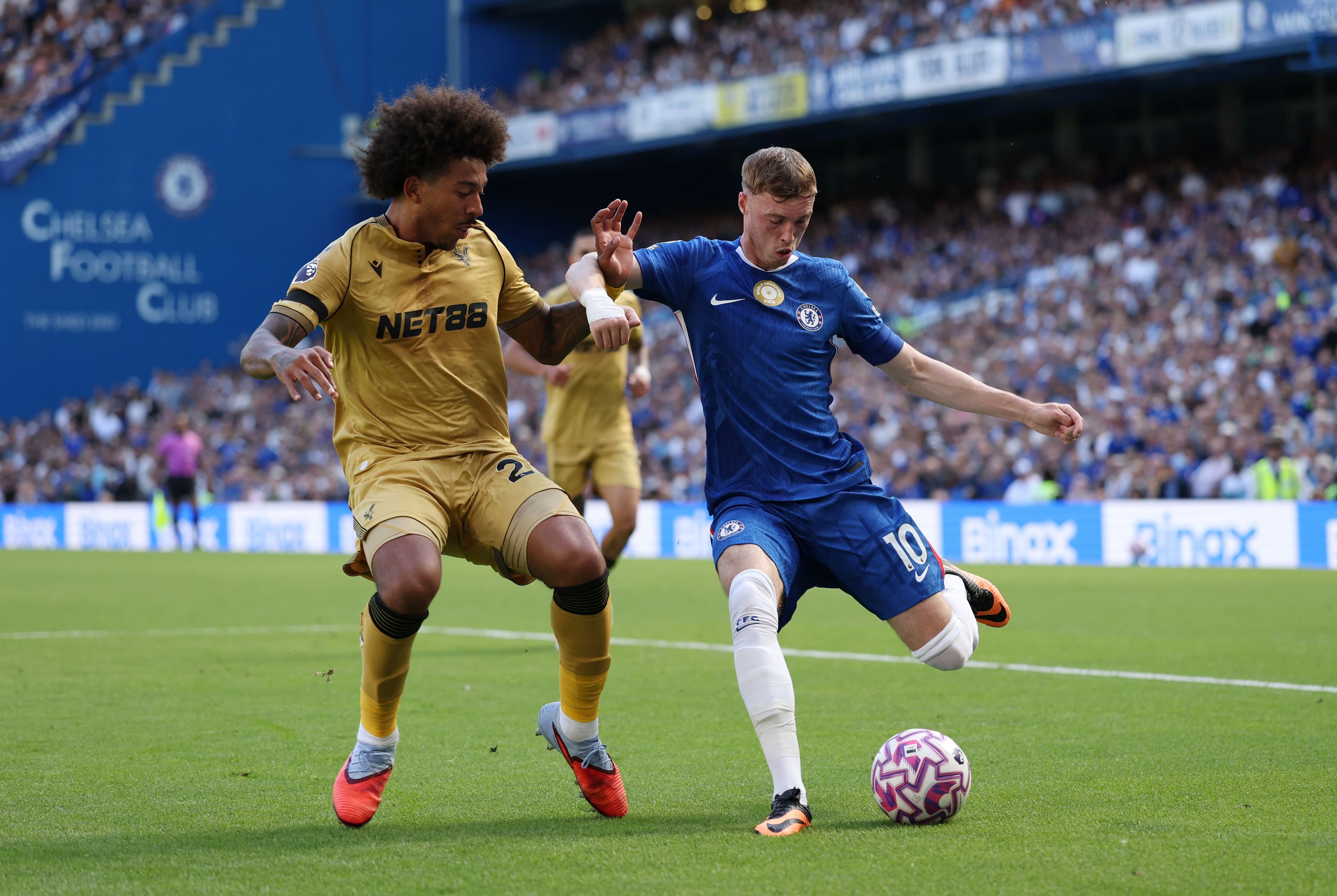 Cole Palmer of Chelsea is challenged by Chris Richards of Crystal Palace