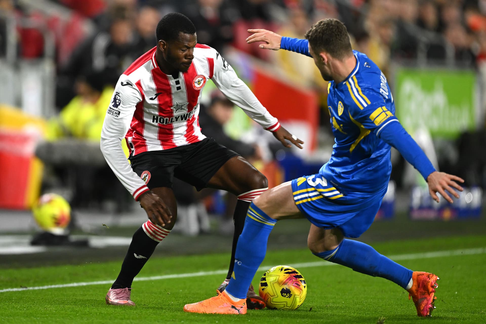 Dango Ouattara of Brentford battles for possession with Gabriel Gudmundsson