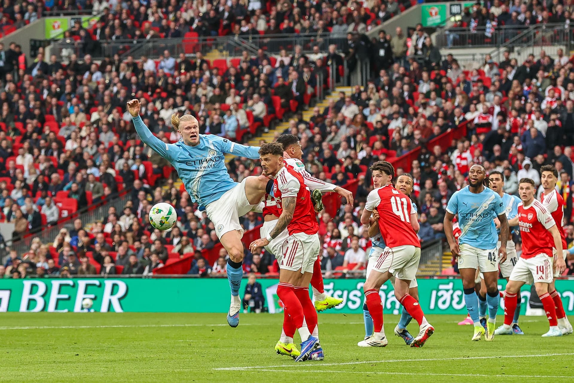 Erling Haaland of Manchester City jumps to head the ball towards goal during the Carabao Cup Final match