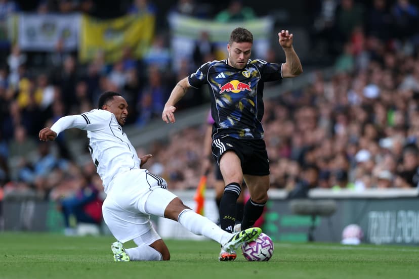 Gabriel Gudmundsson of Leeds United is challenged by Kenny Tete