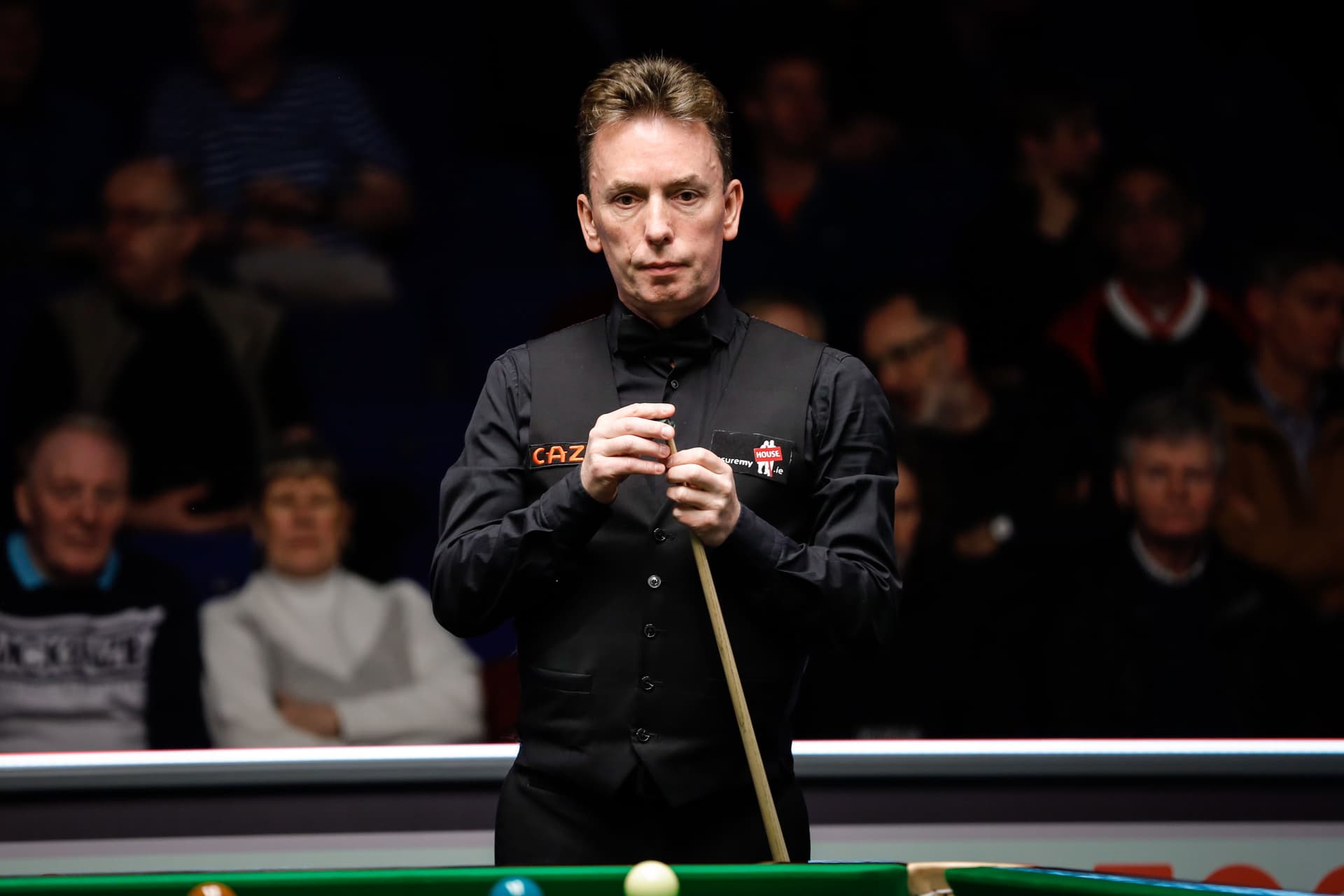 Ken Doherty of Ireland chalks the cue in the second