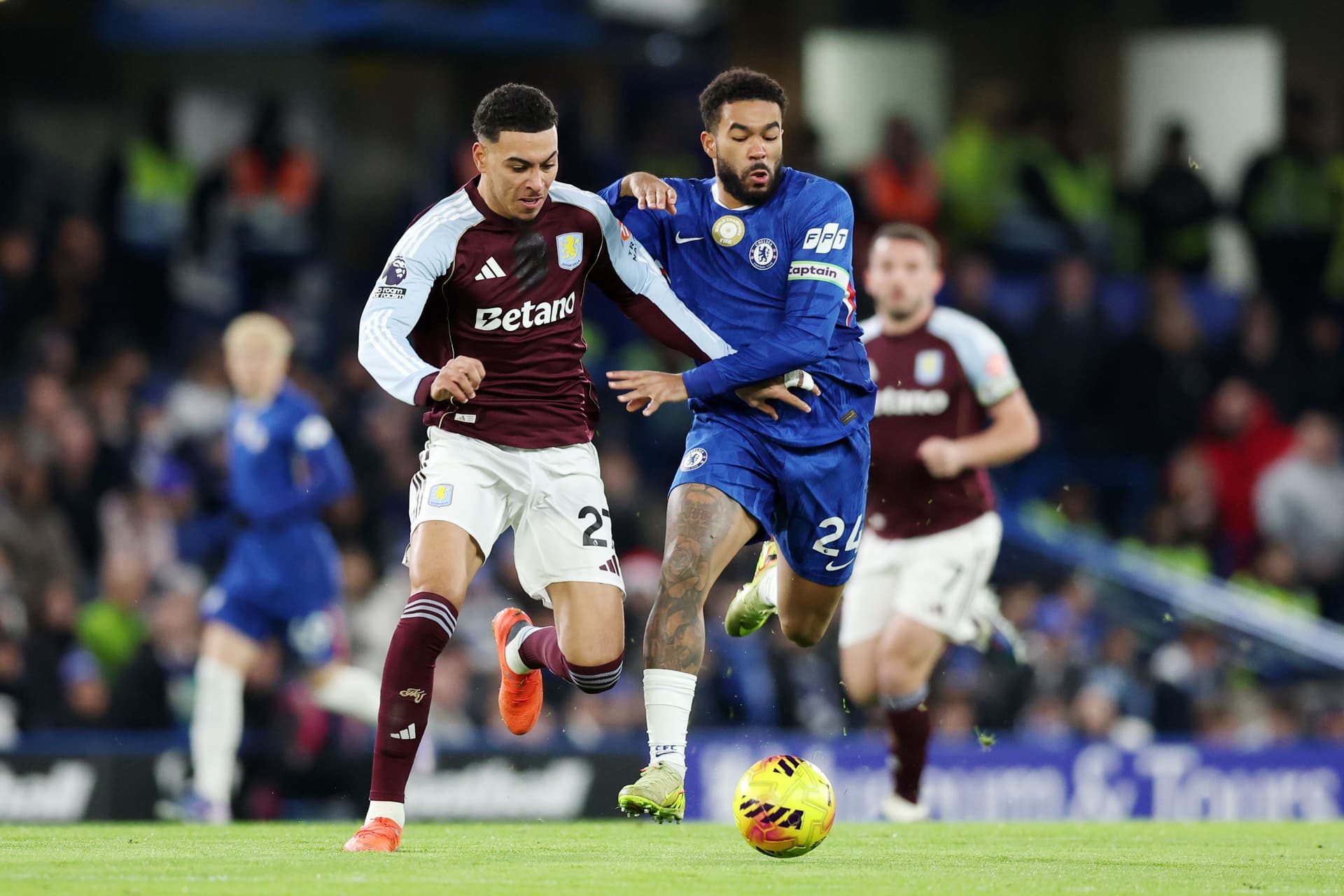 Reece James of Chelsea battles for possession with Morgan Rogers of Aston Villa d