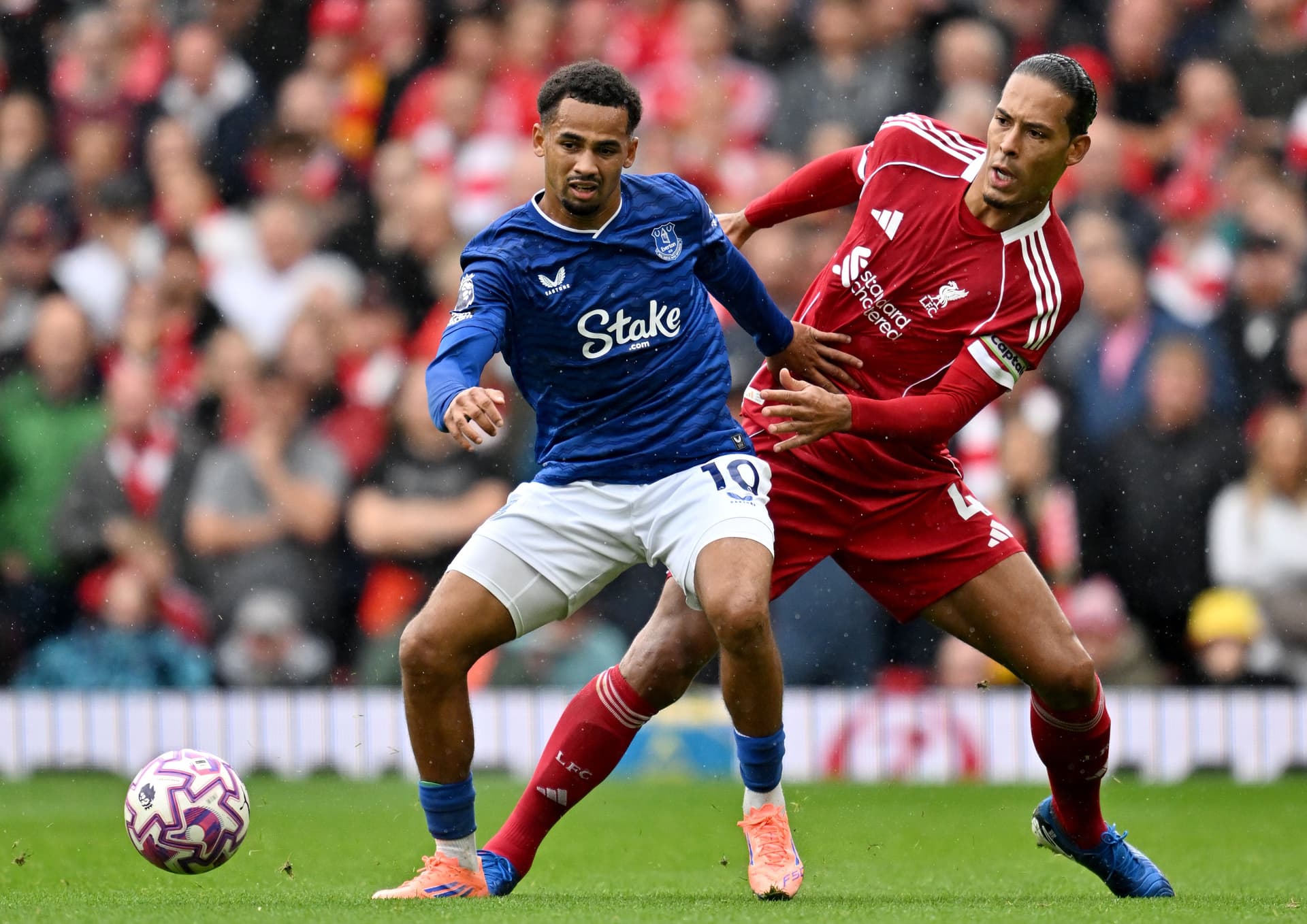 Iliman Ndiaye of Everton and Virgil van Dijk of Liverpool battle for possession