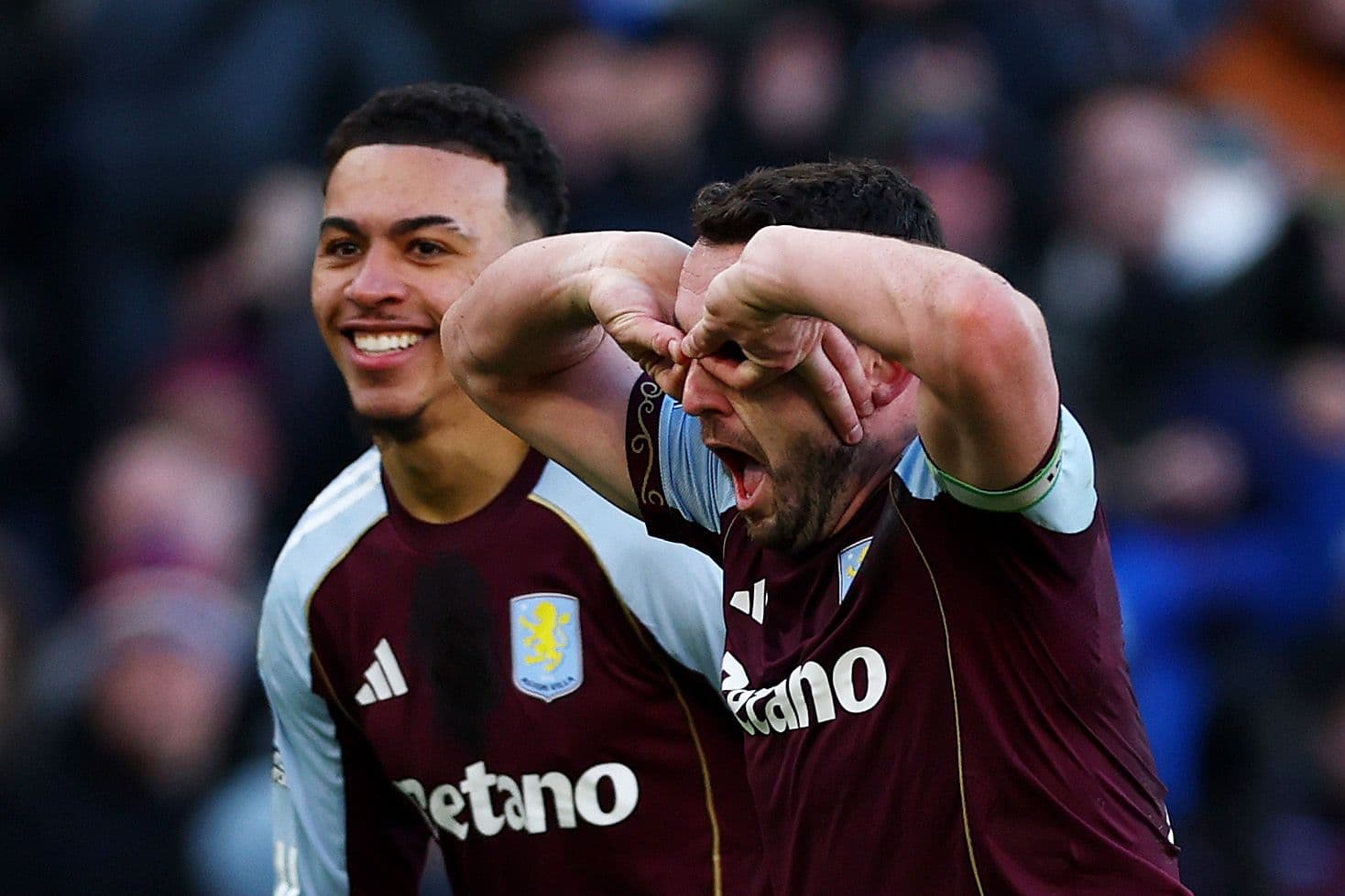 John McGinn of Aston Villa celebrates scoring his team's third goal during the Premier League match