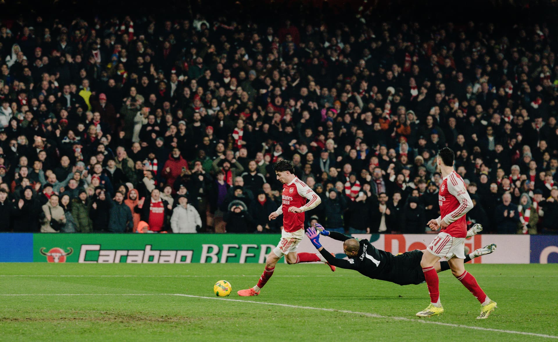 Kai Havertz of Arsenal attempts to score past Roberto Sanchez of Chelsea FC