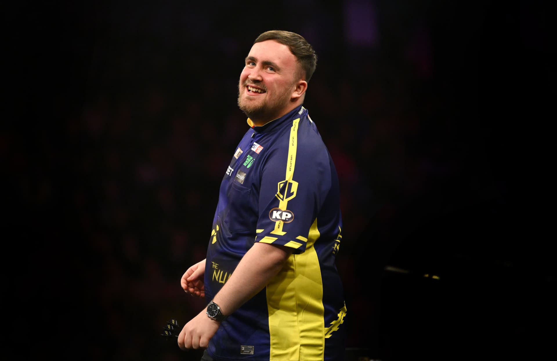 Luke Littler smiles after winning the final