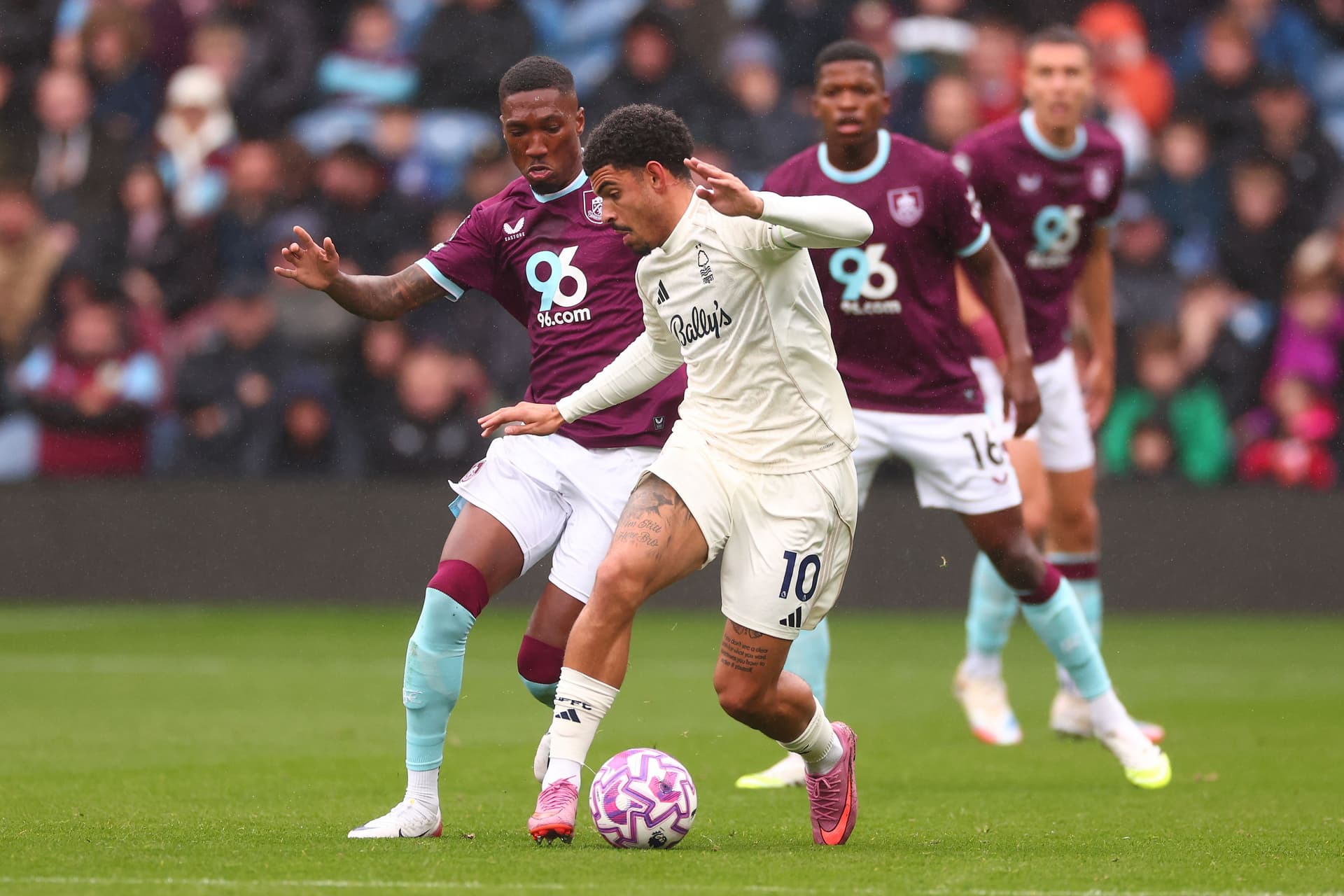 Morgan Gibbs-White of Nottingham Forest is under pressure from Jaidon Anthony