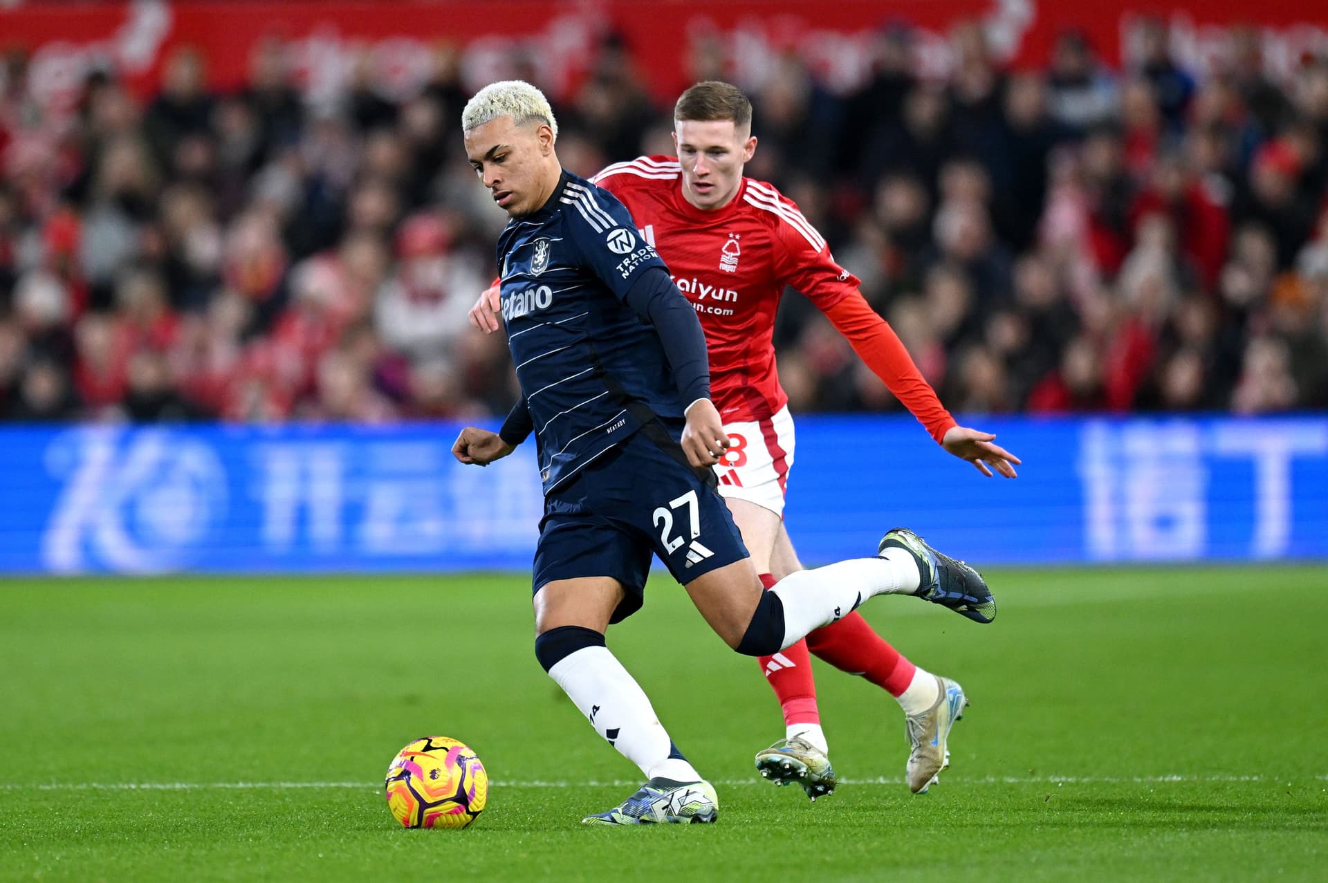 Morgan Rogers is challenged by Elliot Anderson