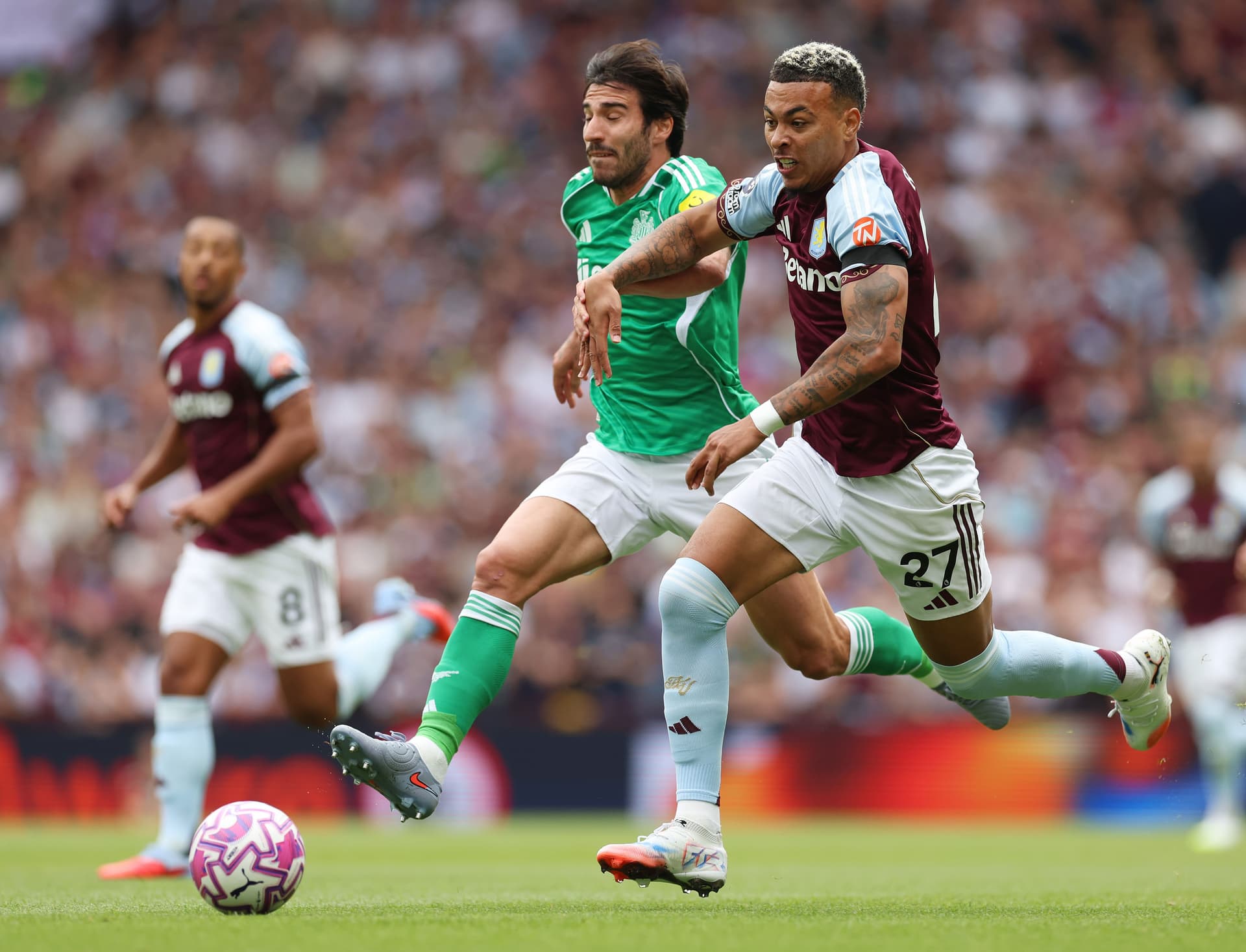 Morgan Rogers of Aston Villa runs with the ball whilst under pressure