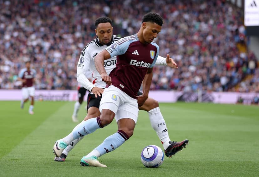 Ollie Watkins of Aston Villa is challenged by Kenny Tete of Fulham during the Premier League match