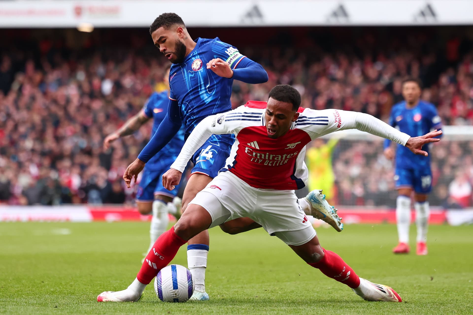 Reece James of Chelsea challenges Gabriel of Arsenal during the Premier League