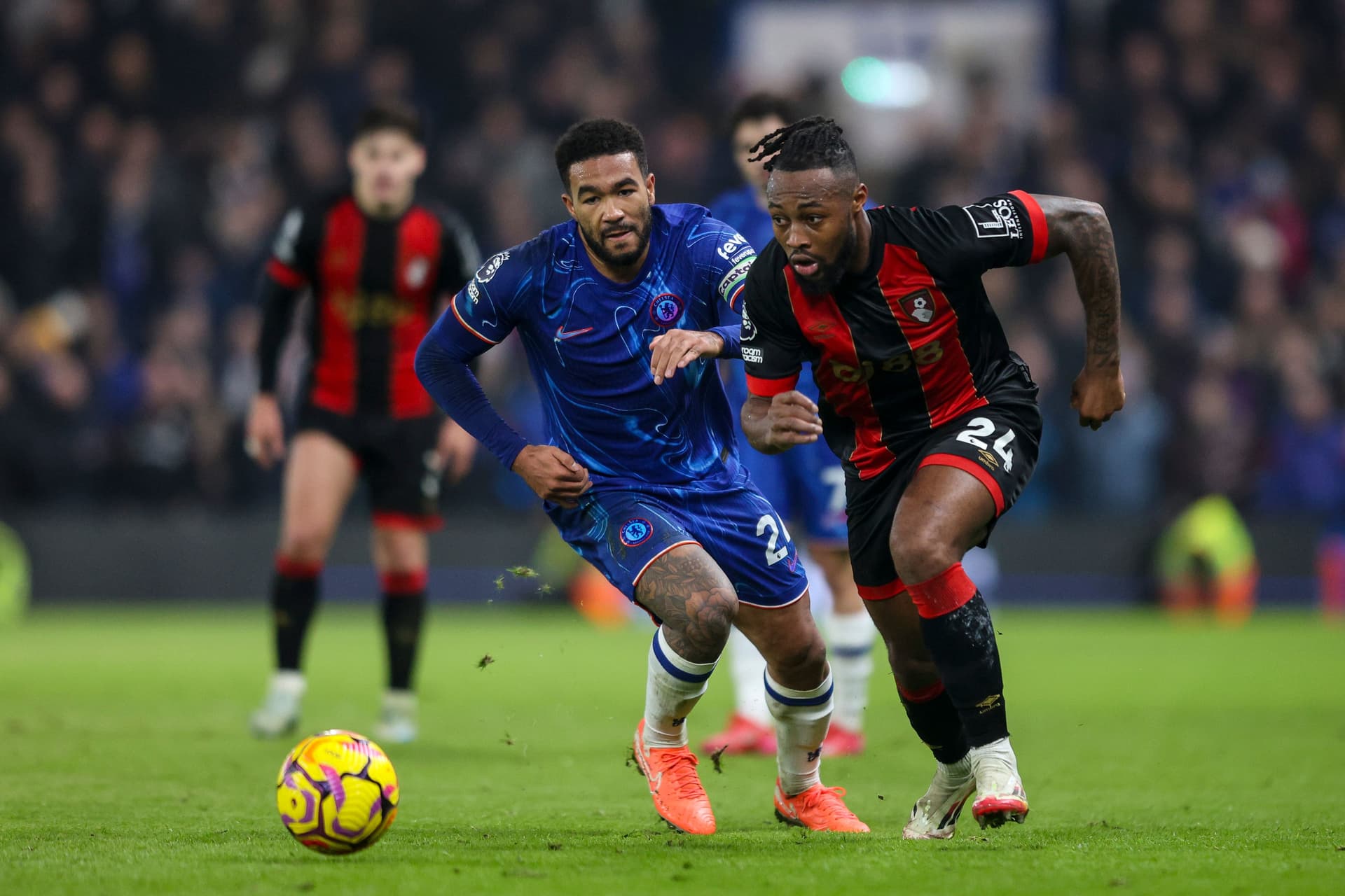 Reece James of Chelsea gives chase to Antoine Semenyo of Bournemouth