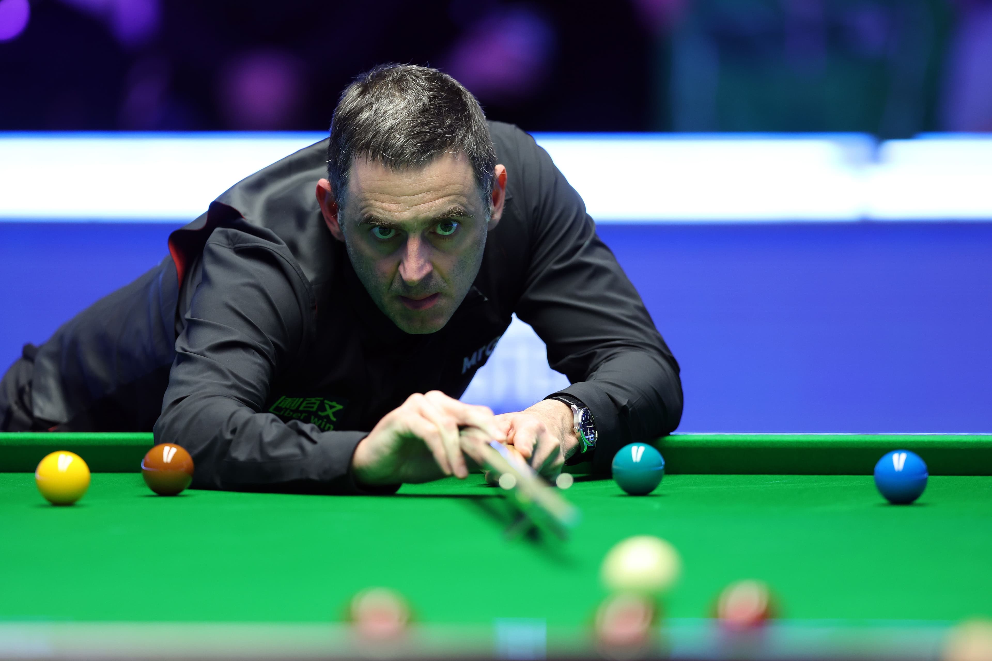 Ronnie O'Sullivan of England prepares to take a shot during the Final match
