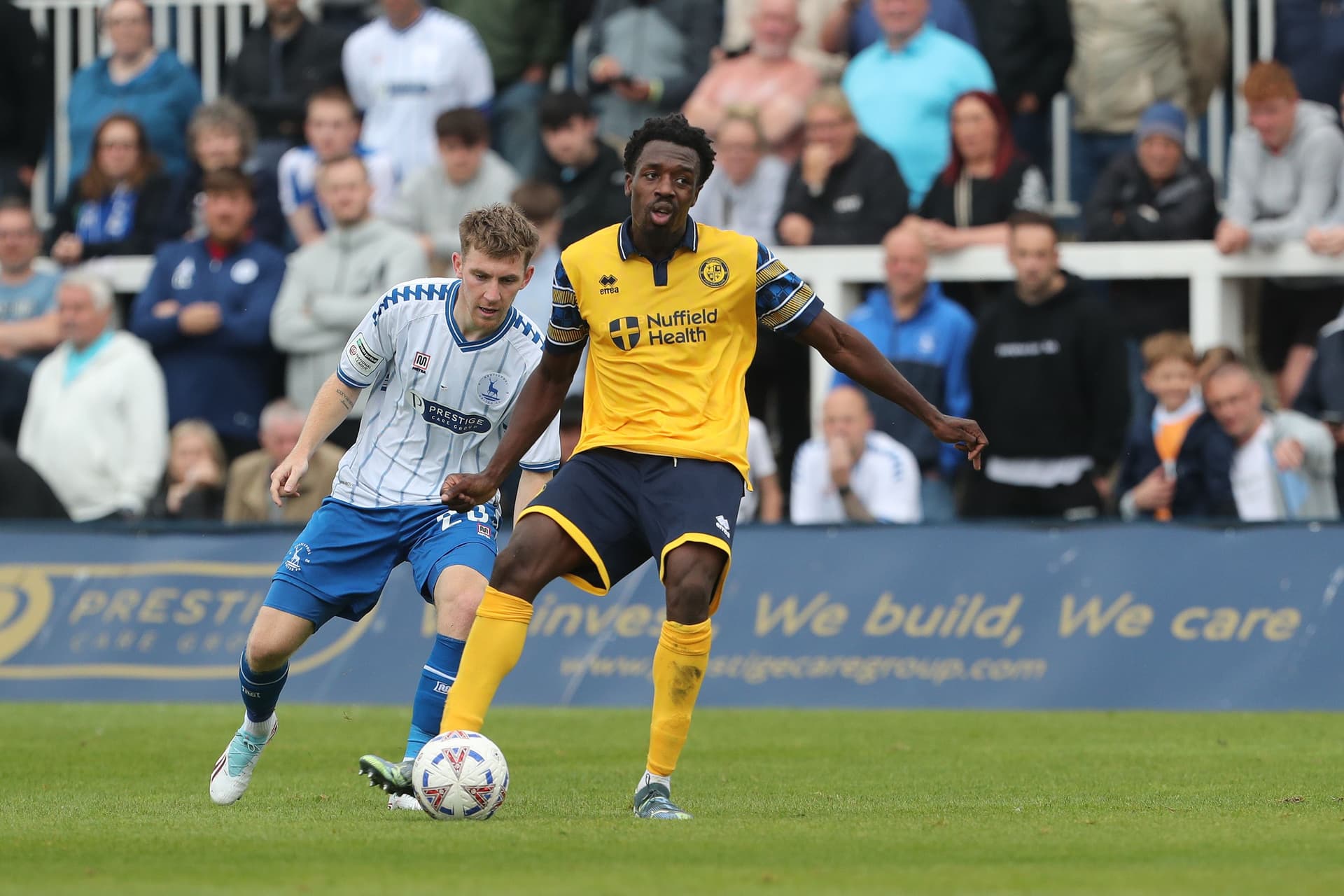 Timi Odusina of Woking plays against Matty Daly of Hartlepool United
