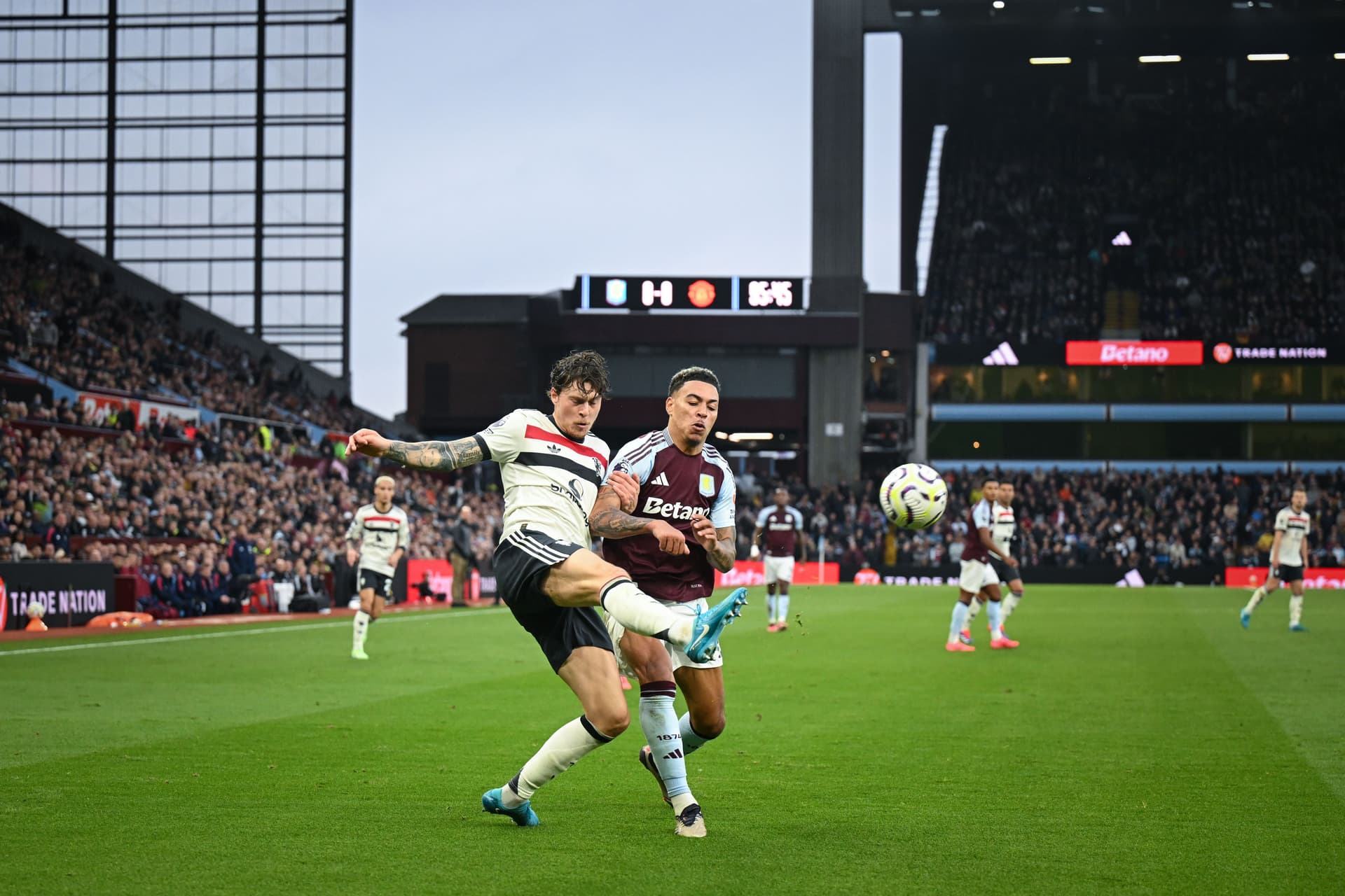Victor Lindelof of Manchester United in action with Morgan Rogers