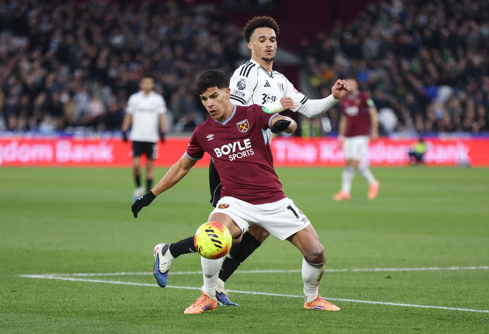 West Ham United's Mateus Fernandes and Fulham's Antonee Robinson